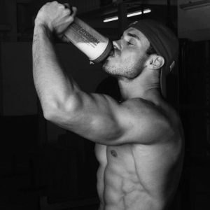 A man drinking protein