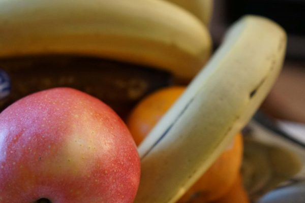 Fruits in a bowl with apples and bananas