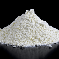 A stack of white protein powder